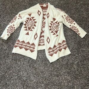 Brown and white sweater. Brand is dreamers by debut, size is small/medium.